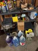 Contents of metal shelf and above stairs includes motor oil, deicers, washer fluid, extension cords, glues, etc