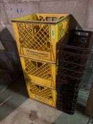 Plastic dairy crates and one wire carrier