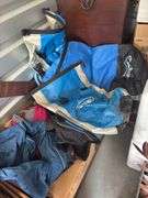 Box of water sports items, including three dry bags and some clothing