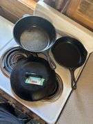 Two cast iron skillets - one lid, one wagner