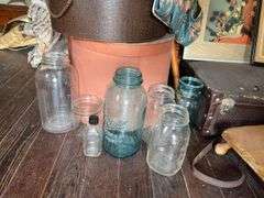 Hat boxes, old suitcase, wooden crutches, canning jars, cane, Booth Special foot warmer???