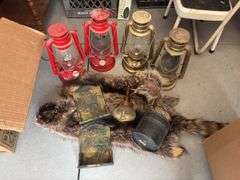 Four modern lanterns, brass bookends, brass school bell, raccoon hides