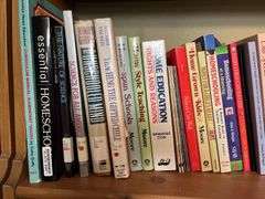3 shelves of books and magazines Please see photos