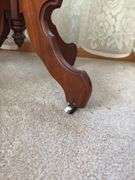 Antique walnut parlor table with original porcelain casters 20 x 31