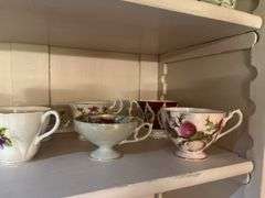 Lots of cute knick knacks and cups & saucers (We don’t know if they match!)