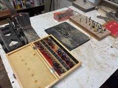 Large router table includes router and lots of router bits - try to come at the end - may need disassembled to remove