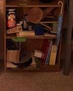 Contents of metal shelf and two other shelves-snack sets, cookie jar, S&P’s, vases, books, record albums, etc