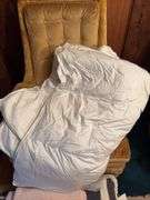 Two twin size down comforters, one does have a hole that needs repaired