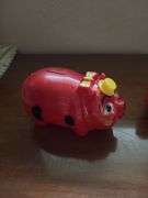 Three piggy banks and one pig with Grand Rapids Minnesota advertising