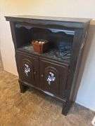Small cupboard with floral painted design