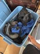 Box of water sports items, including three dry bags and some clothing