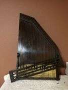 2 stringed musical instruments, Apollo Harp and another similar one