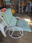 Two swivel patio chair One cushion does have hole
