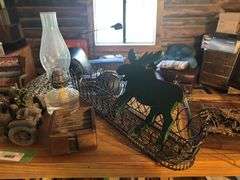 Treasures on top of bookshelf, Lighted Thomas Kincade print, lamp, decor items,