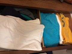 Contents of dresser includes various men’s shirts, sweaters and shoes All various sizes
