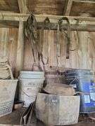 Oil, old gas cans, buckets, cast iron skillet, nails and more All on and under shelf