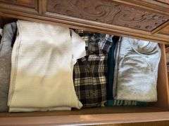Contents of dresser includes men’s thermals size L, women’s flannel shirts size M, sweaters, heavy undershirts, jeans Clothing is all sizes
