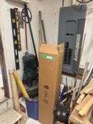 Corner of shop, including large box of new fluorescent bulbs