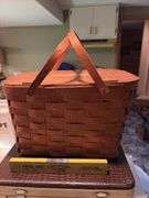 Vintage suitcase, picnic basket and wooden Coast to Coast level
