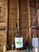 Various fishing poles, dip nets, reels, cleaning supplies