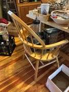Large light pine dining room table with one self storing leaf and 5 mismatched chairs