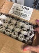 Corner of shop, including large box of new fluorescent bulbs