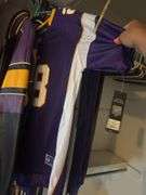 Large assortment of Minnesota Vikings clothing, some still with tags - these all have been in a smoking home