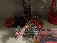 Winged Wheel No. 500 lantern, ignition tune up kit, tow light kit and spark plug wire set