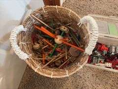 Basket of large tinker toys and Erector set pieces