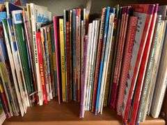 2 shelves of mostly kids books and young readers books