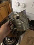 Heavy pewter trays, pampered chef baking pans, antique cast iron corn bread mold and antique four sifter