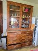 2pc oak cupboard with glass door top and 10 drawer base 26D x 56L x 90H Bring tools to take apart!