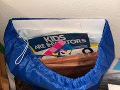 Metal shelf unit, education materials all in closet