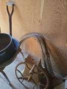 Grapple hay forks, old car tires (3pr), steel wheel, hand crank sheep shear head, old steel baby crib, primitive homemade stilts