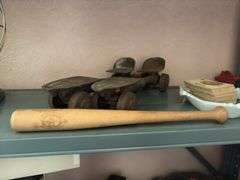 Old metal skates, alphabet cards, Bubba Bat Boy mini bat, rubber articulated construction vehicle