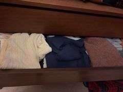 Contents of dresser includes various men’s shirts, sweaters and shoes All various sizes