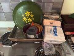 Kitchen scrubbers, rolling pins, mixing bowls, serving trays, hand towels, etc and a drawer of kitchen utensils
