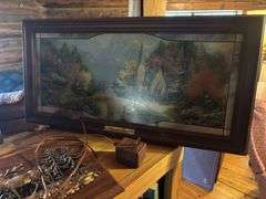 Treasures on top of bookshelf, Lighted Thomas Kincade print, lamp, decor items,