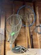 Various fishing poles, dip nets, reels, cleaning supplies