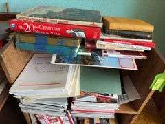 Small bookcase full of all kinds of reading materials