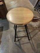 Three round folding stools and two folding chairs