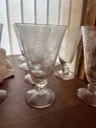 Small knee hole desk and assorted stemware, dishes etc...