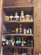 Small rolling tool box and tools as shown on left half of bench and wall