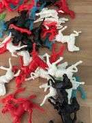 Plastic cowboys, Indians and horses and six lead soldiers