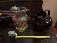 Two vintage juice pitchers-Ruby red ball and clear glass with fruit design