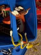 Tote of various toys from the 90's ish