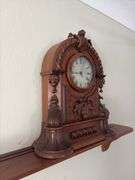 Antique walnut key wind shelf clock, very ornate carved case. Not sure if American or European ???