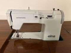 Elna sewing machine in walnut stand 18D x 36L x 31H