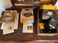 Kodak Easy Share camera C875, Kodak East Share camera Z1285 and Kodak Scanza digital film scanner
