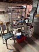 Metal shelving unit with contents, office chair, tool boxes and plastic stackable storage bins with empty coffee cans
